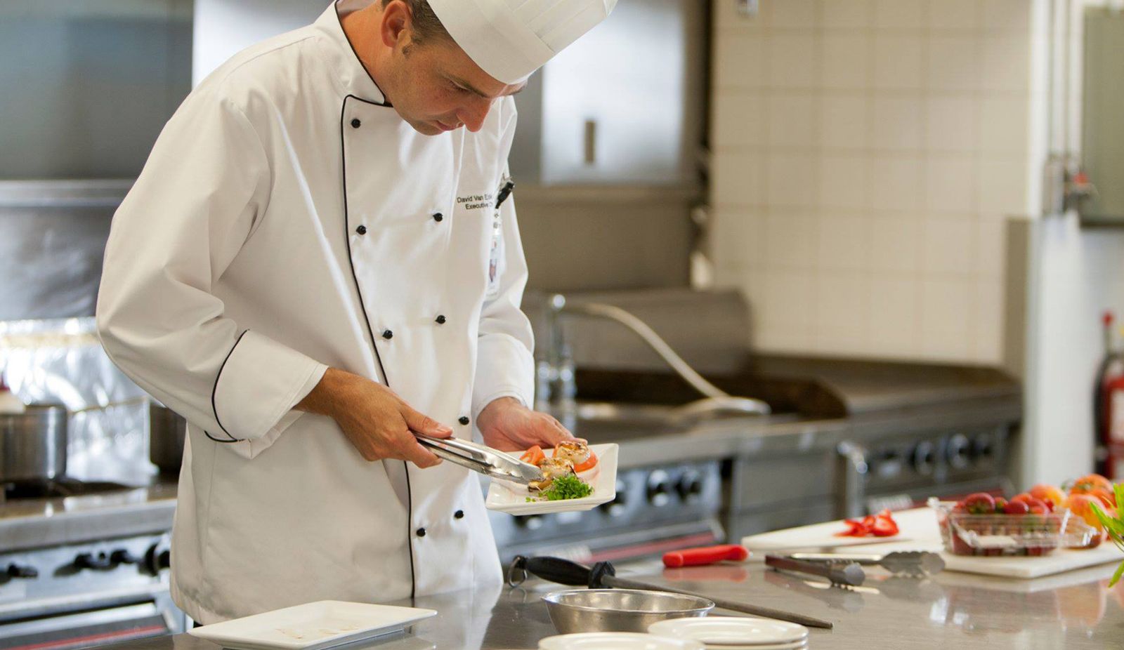 chef preparing food on a plate