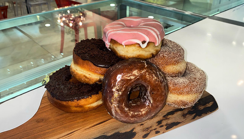 An array of donuts stacjed on a charcuterie board i the Rhino Lounge in Museum London