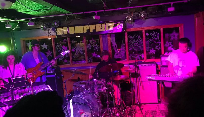 A band performing in front of engaging crowd at Poachers Arms