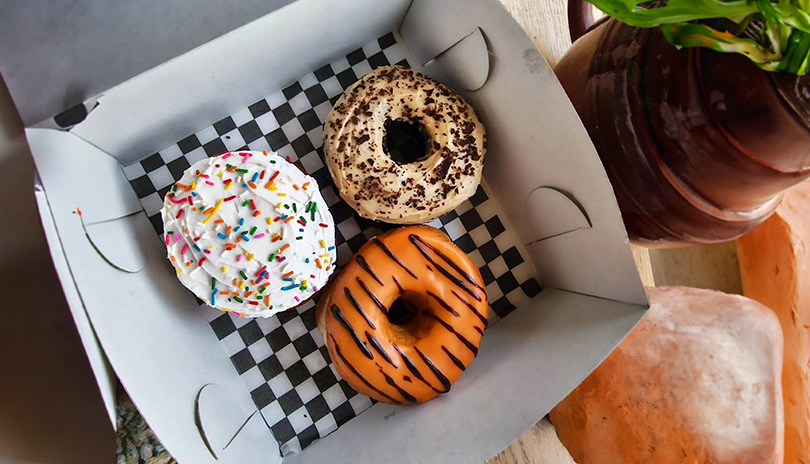 Three delicious donuts from V Food Spot in a box