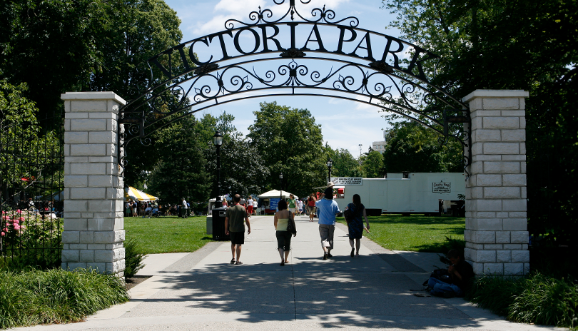 Group of people walking into a festival at Victoria Park