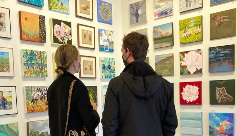 Customers looking at art in the Westland Gallery