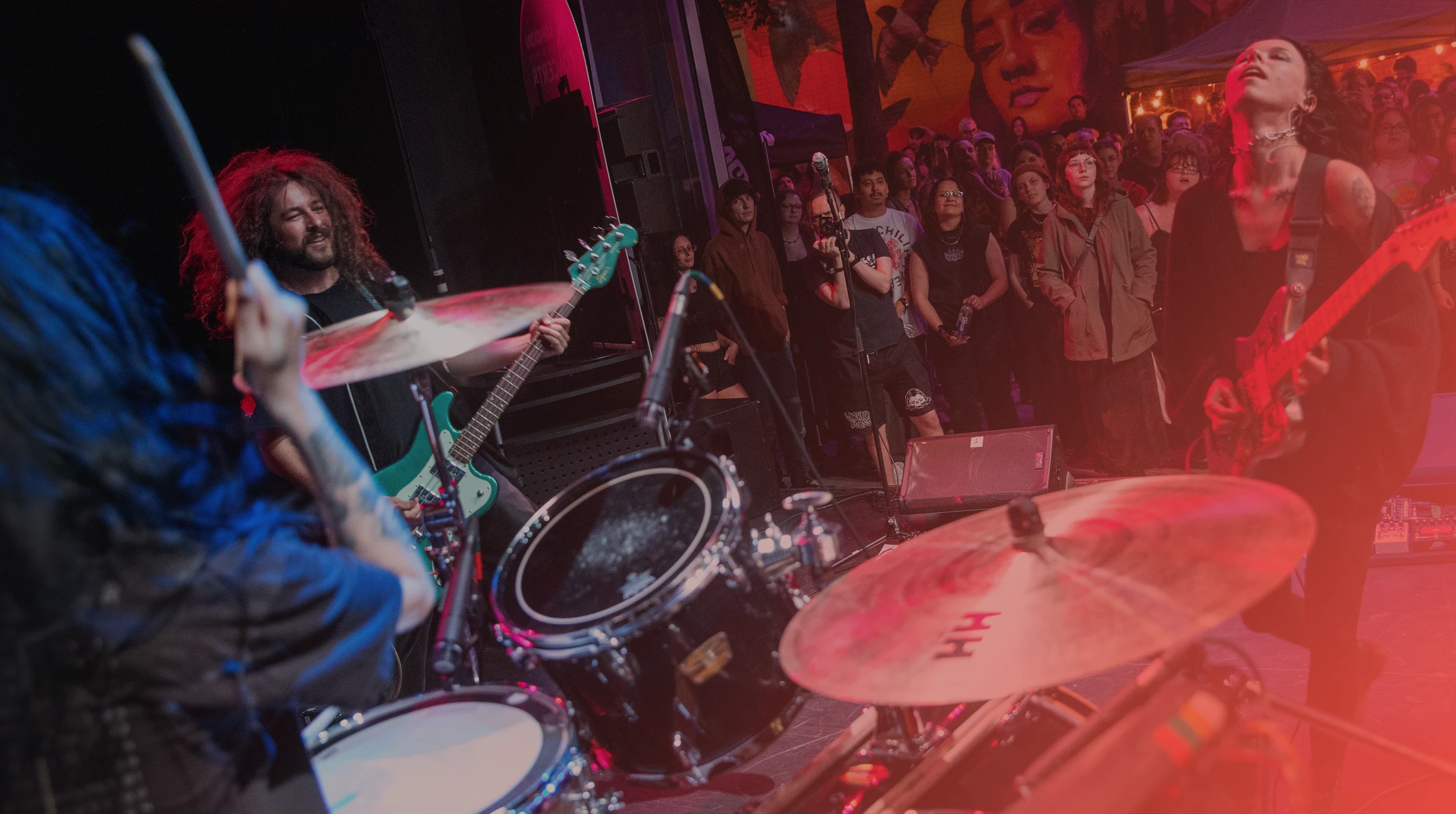 a band playing on a stage in front of audience
