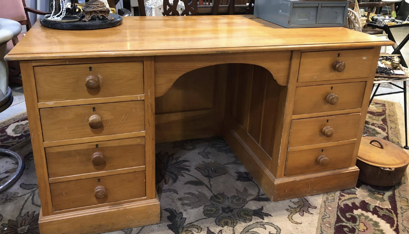 A wooden antique dresser at Cobbletog Antiques Market in London, Ontario.