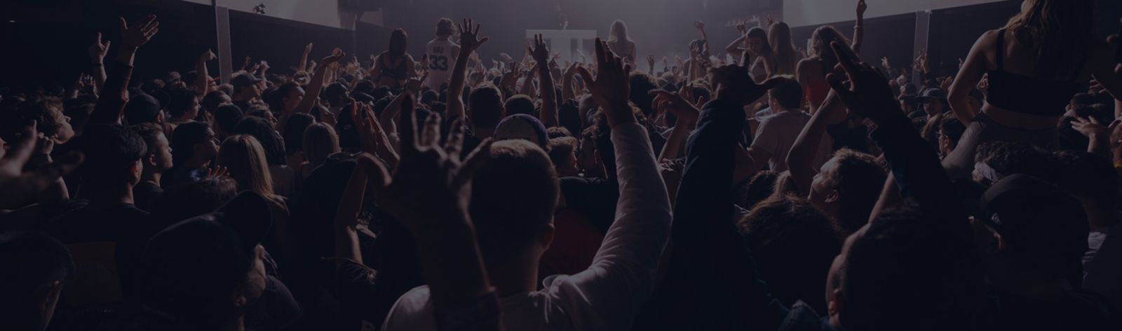 audience looking at stage of musicians