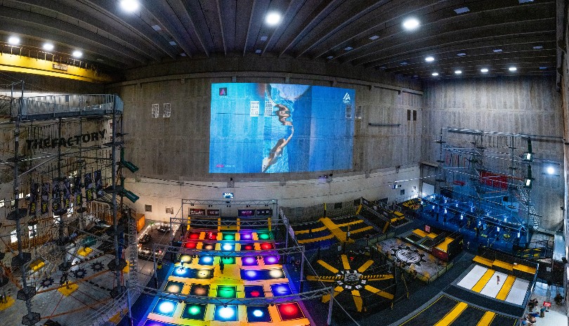 Overhead shot of the trampolines, ziplines and ropes courses of The Factory at 100 Kellogg Lane