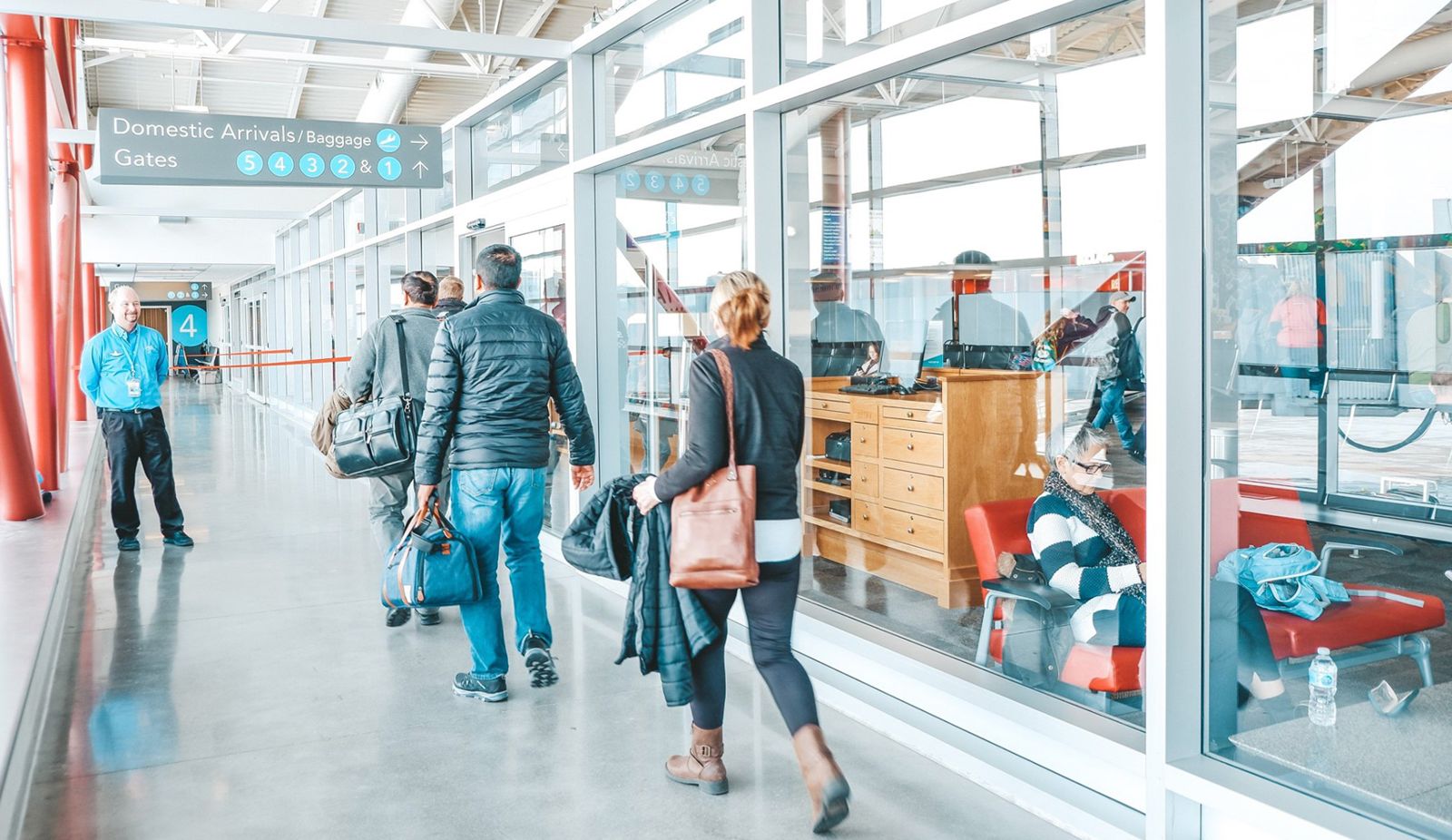 travelers walking into London Airport