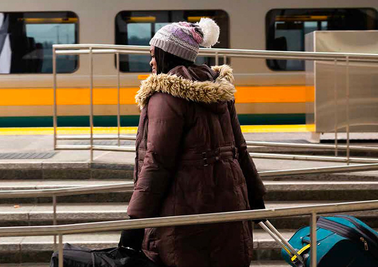 traveler walking to train platform