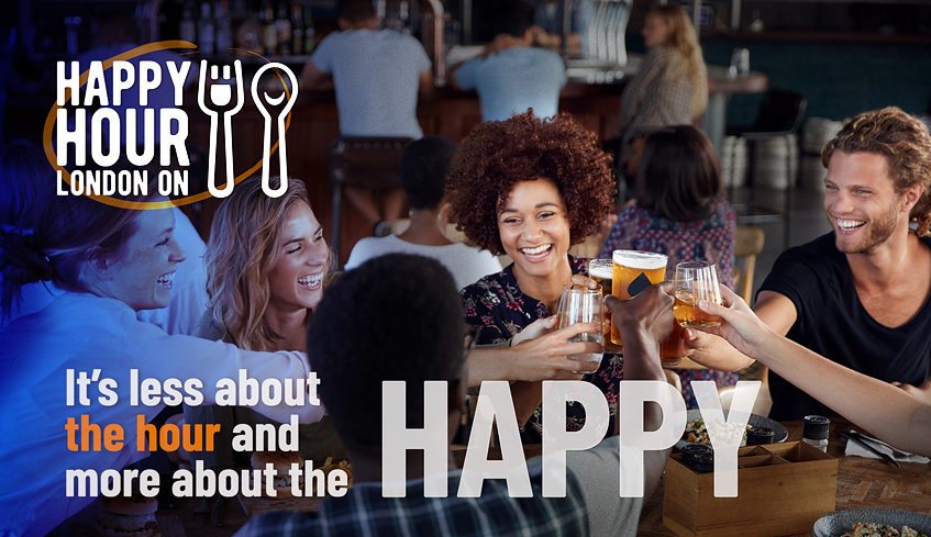 A group of people at a pub celebrating and raising their glasses for a cheer