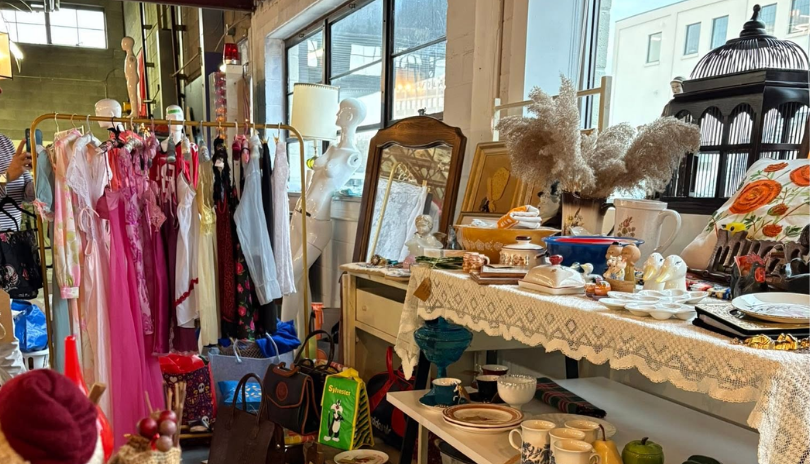 A clothing rack and display of vintage goods at Old East Vintage Market in London, Ontario.