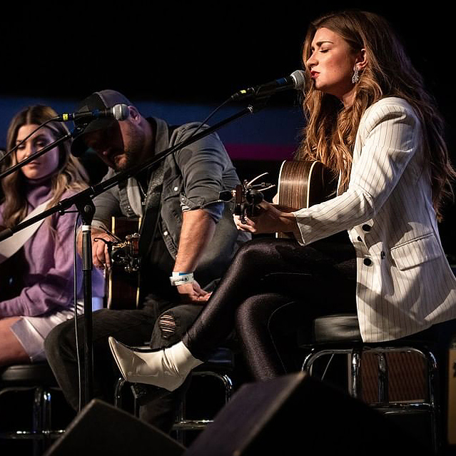 musicians on stage playing instruments