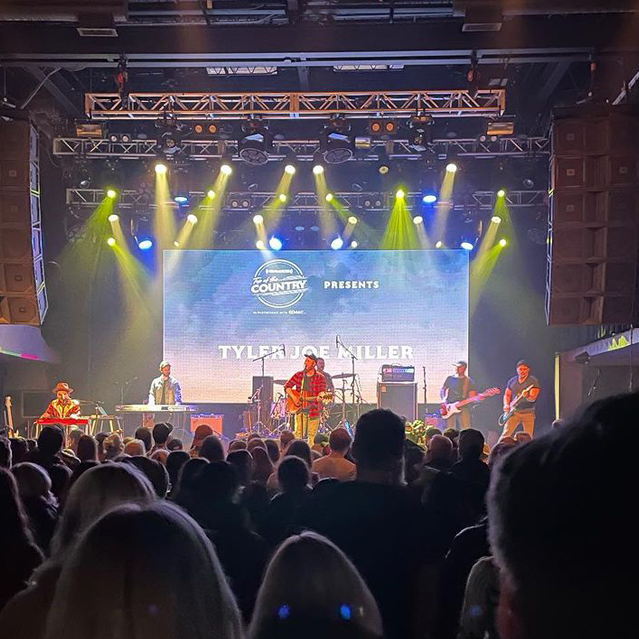 audience watching musical artists on stage