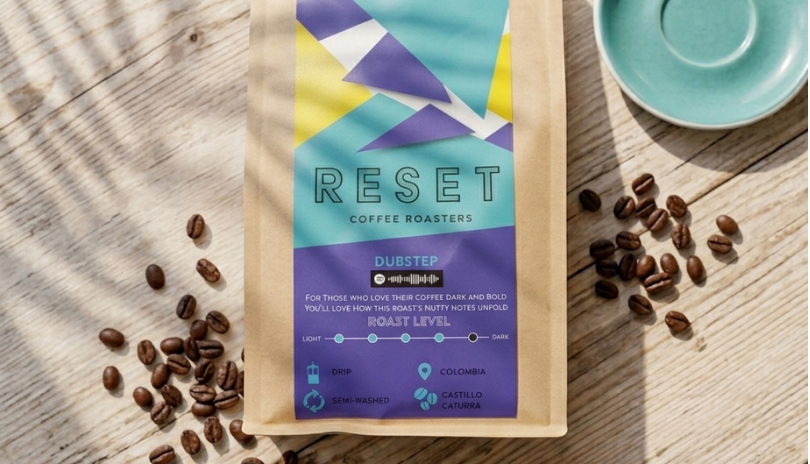 View from above of bag of coffee beans from Reset Social Cafe on a brightly lit table.