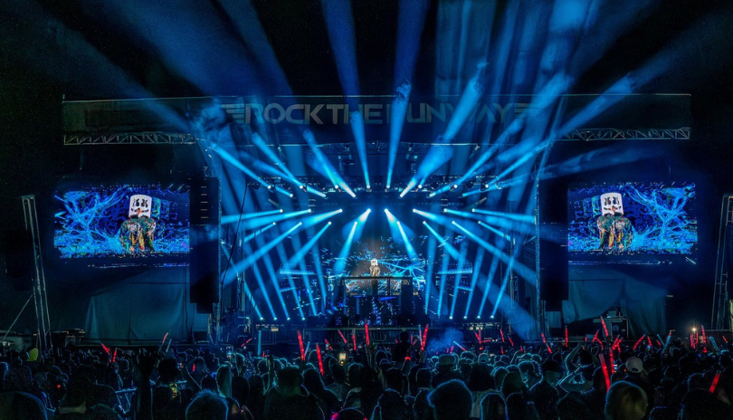 A crowd in front of a big stage at night as Marshmello plays Rock the Runway in London, Ontario.