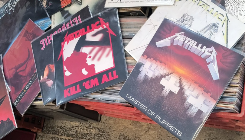 Several rock records laid out on milk crates at Speed City Records in London, Ontario.