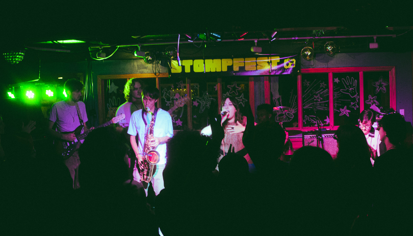 A band performing in front of engaging crowd at Poachers Arms