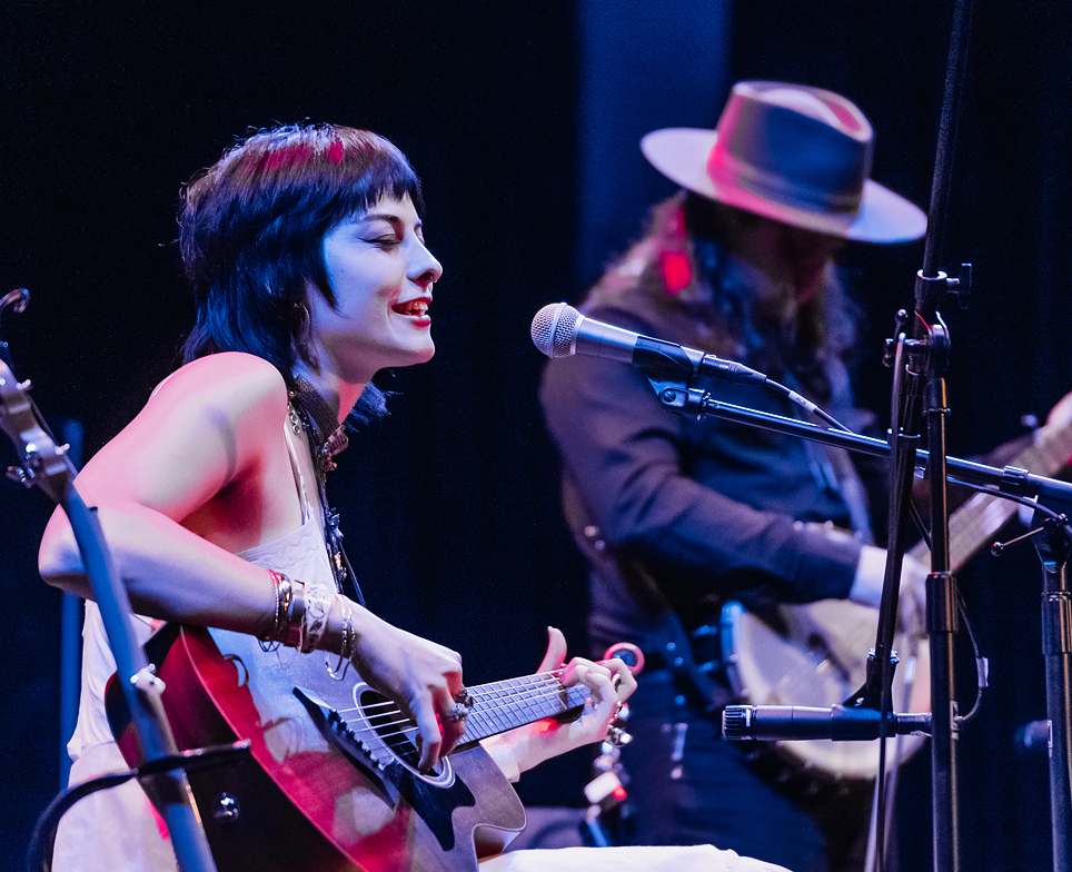 musicians on stage performing with instruments