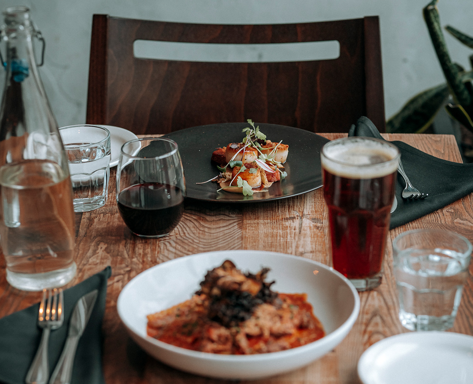 food plates and glasses on a table