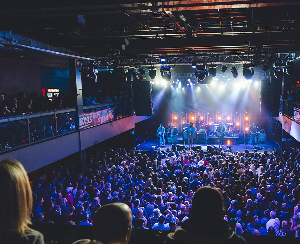 audience looking at musicians on stage at london music hall