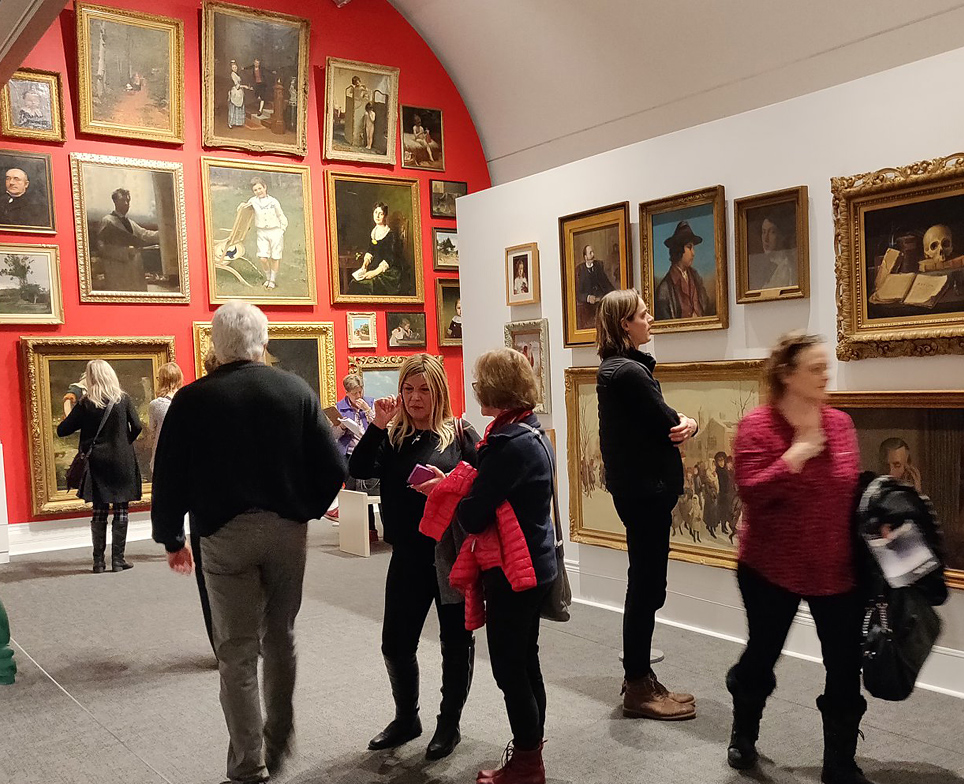 people looking at art at museum london
