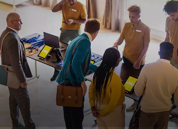 people standing in front of a table