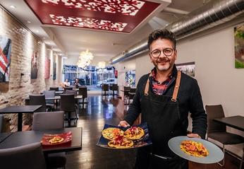 Marvin Rivas owner of Che RestoBar stands in the main dining room of Che RestoBar located in London, Ontario