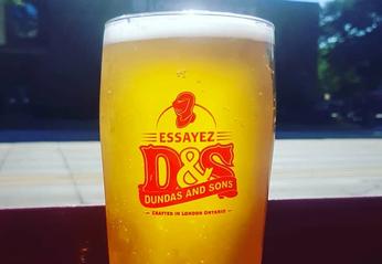 A glass filled with beer from Dundas & Sons Brewing Company located in London, Ontario