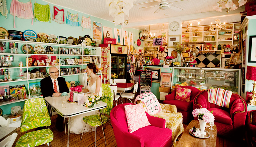 Two people sitting at a table in the interior dining room of The Bag Lady located in London, Ontario