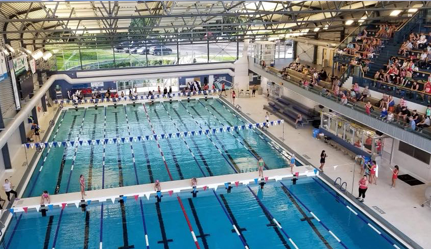 An aerial view of swimmers about to race in the Canada Games Aquatic Centre located in London, Ontario